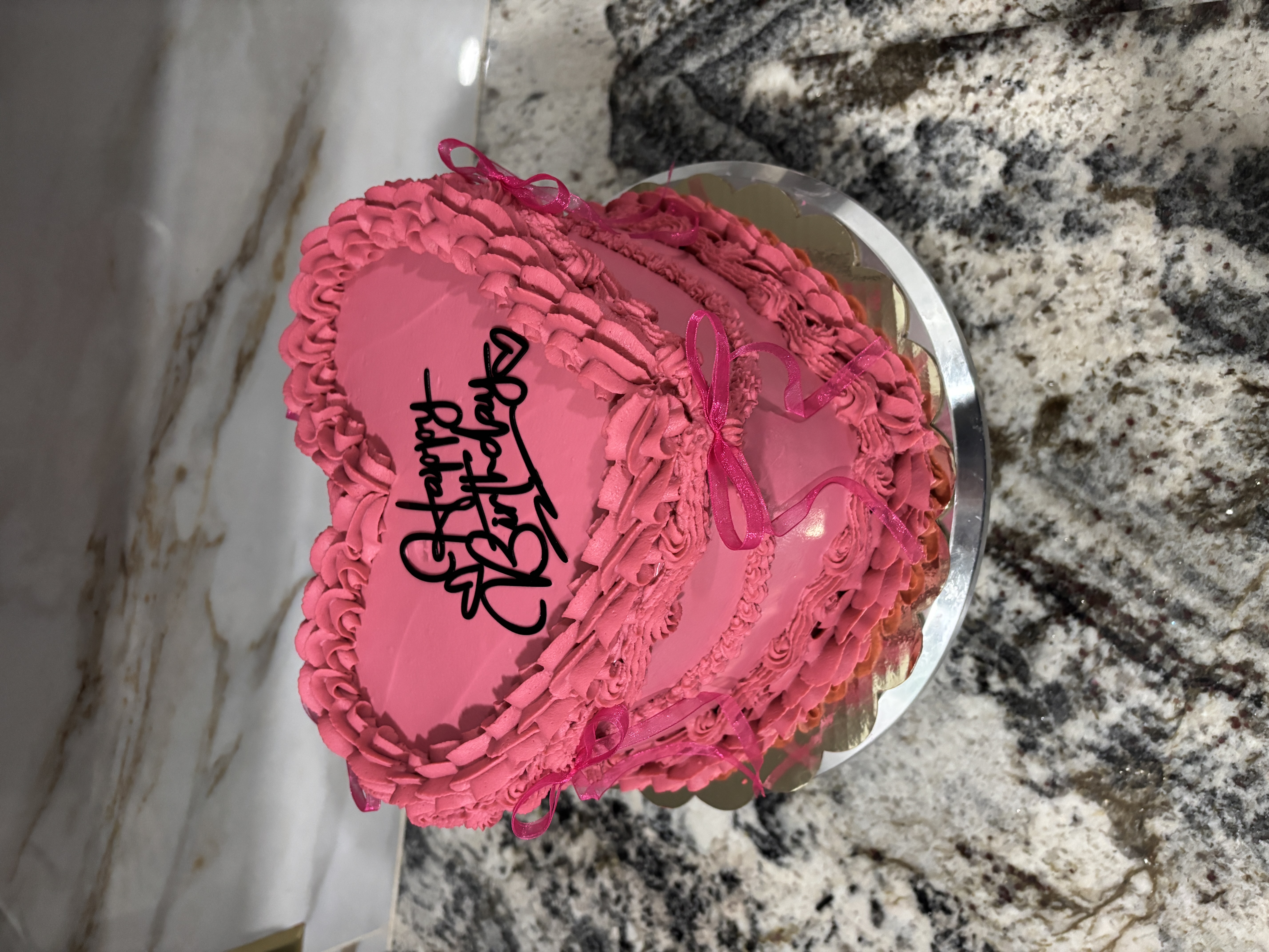 Pink buttercream cake with berries